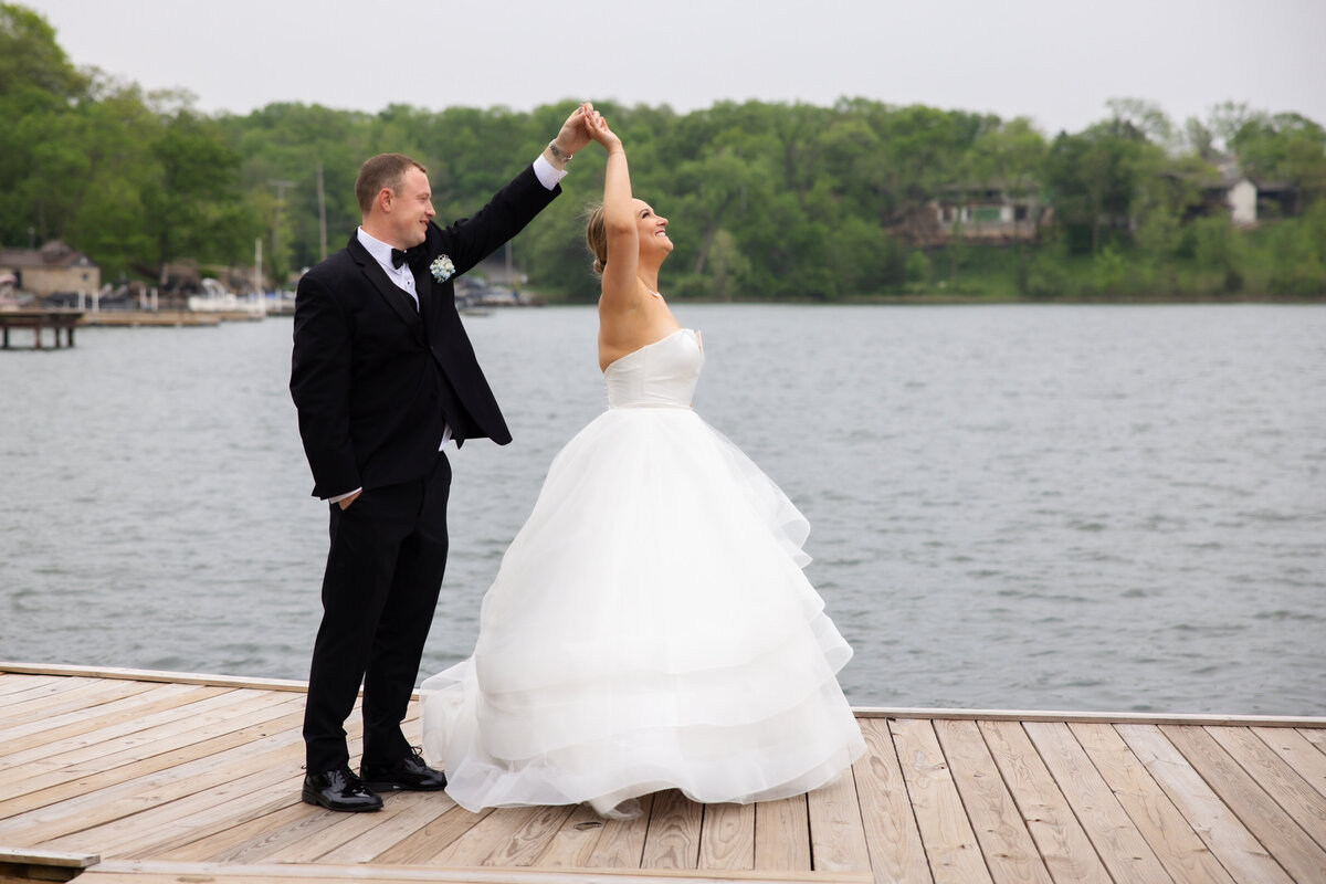 Bride and Groom on dock of Lake Quivira dancing