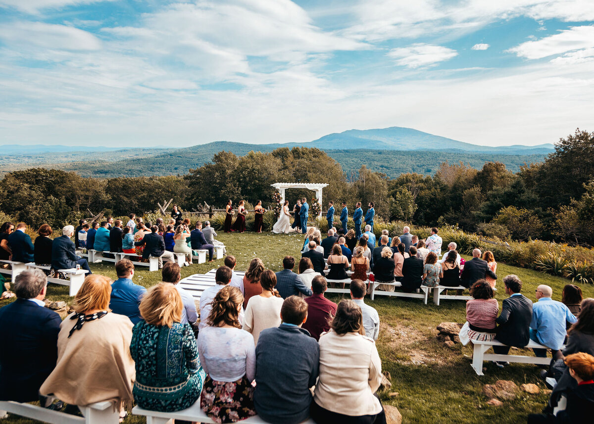 Mountain views at windy wedding ceremony at Cobb Hill Estate in NH By Lisa Smith Photography