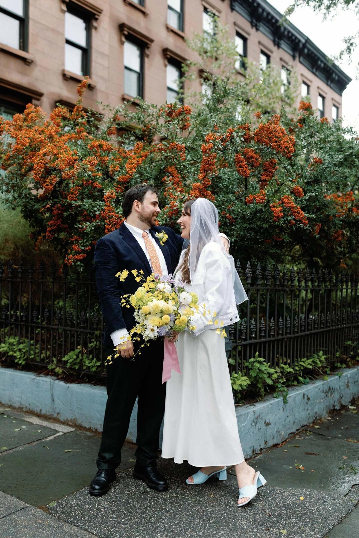 Brooklyn fort greene wedding with yellow flowers white denim jacket and veil