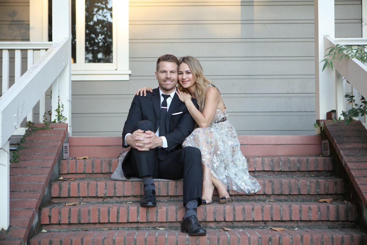 Engagement Photos on a Porch with Brick Steps at Holbrook Palmer Park