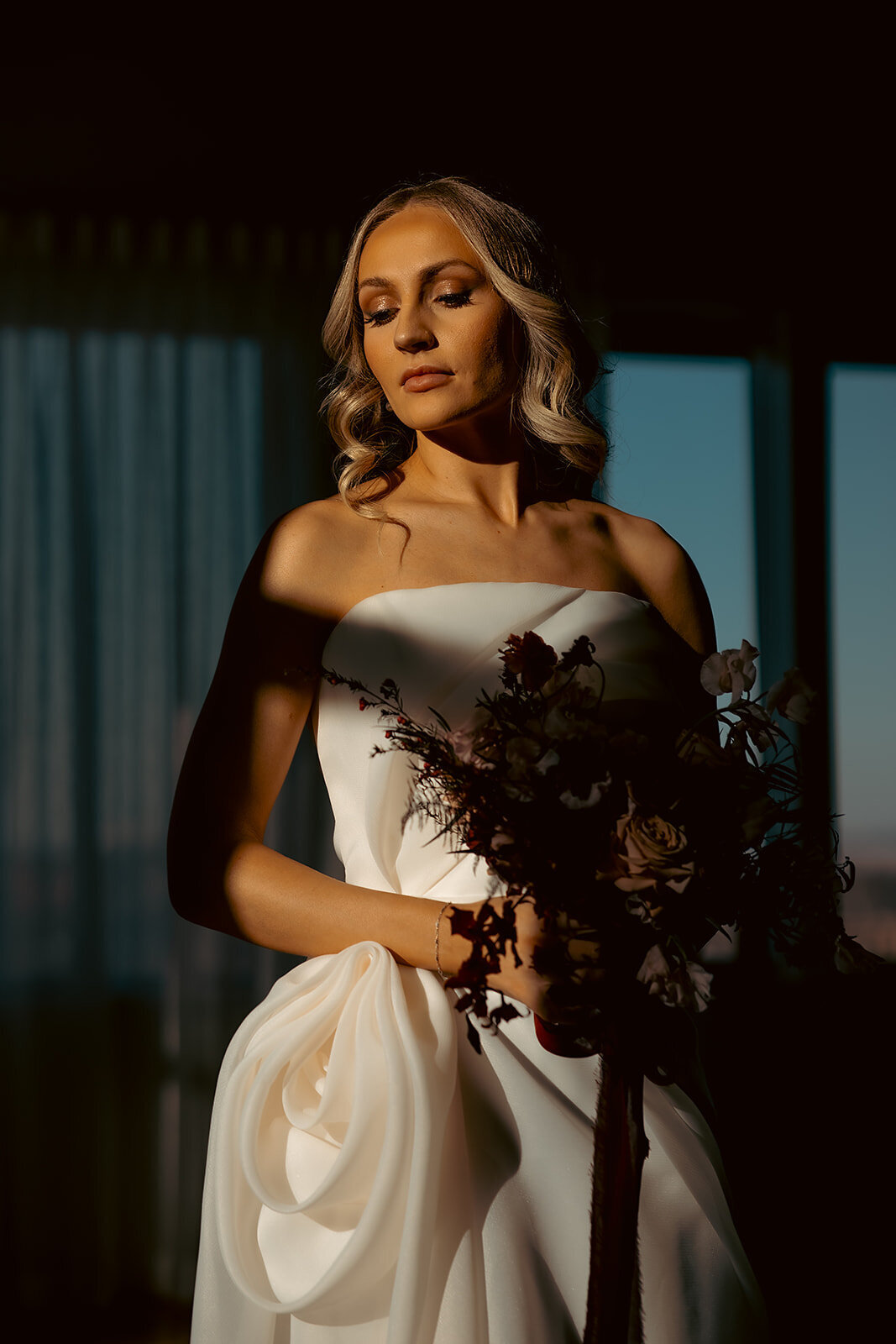 "Bride and groom celebrate their elegant luxury wedding at the historic Cottonwood Hotel in Omaha, NE – timeless moments captured by Tori Nichole Photography. A perfect blend of sophistication, romance, and architectural charm, showcasing the couple's love story in an unforgettable setting.