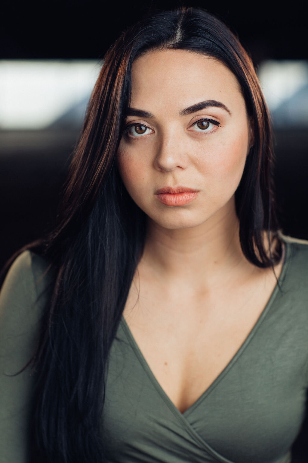 Headshot Photograph Of Young Woman In Gray V-Neckline Blouse Los Angeles