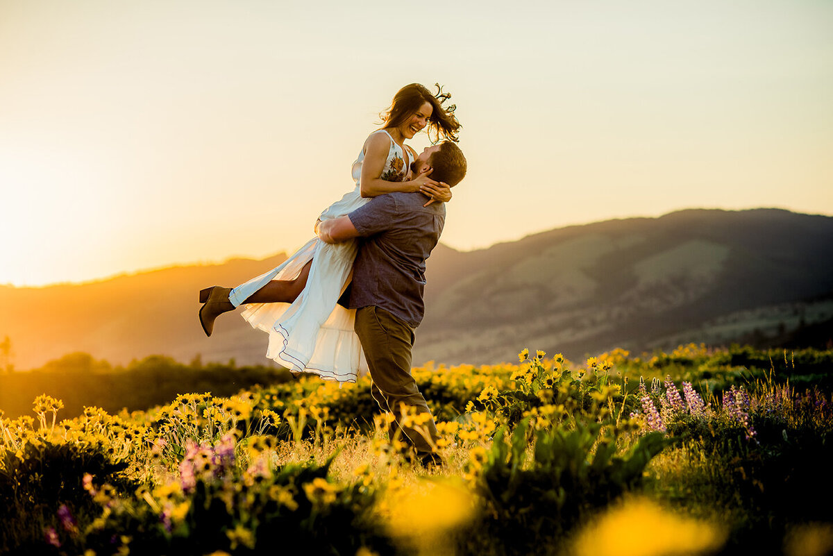 couple dancing in sun and fowers