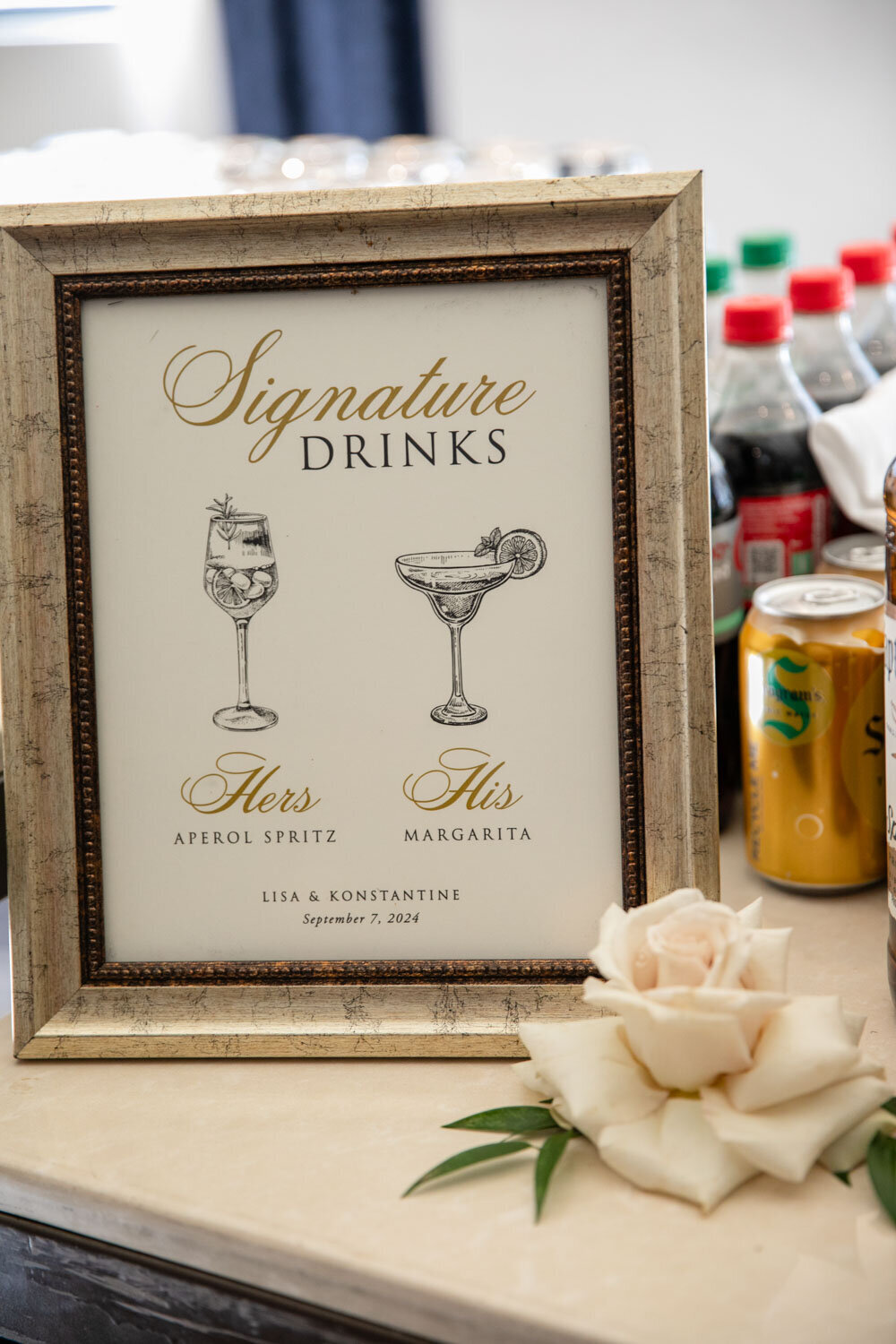 A framed sign that says signature drinks on it