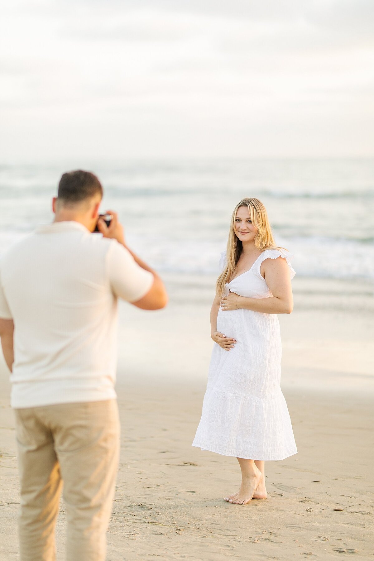 Pregnant mom and dad on the beach in Del Mar photographed by Sherr Weddings.