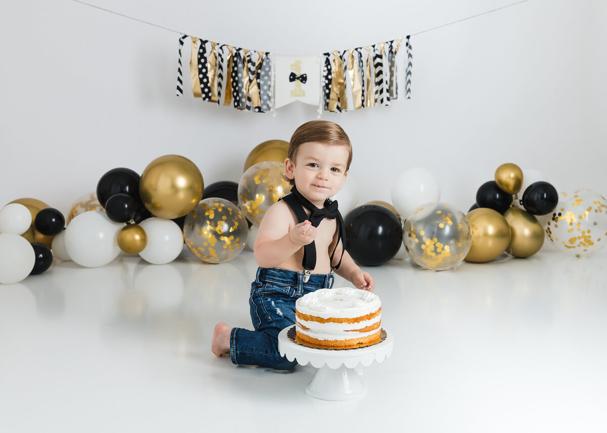 Light and airy lifestyle portrait of a baby at a 1st birthday cake smash photo session at Allison Reilly's Union County, NJ photo studio.