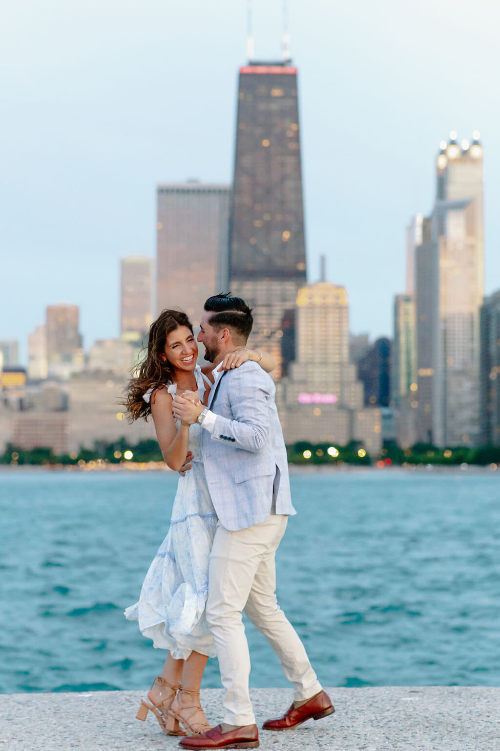 An engagement photography session at The Wrigley Building and North Ave Beach in Chicago, Illinois - 48