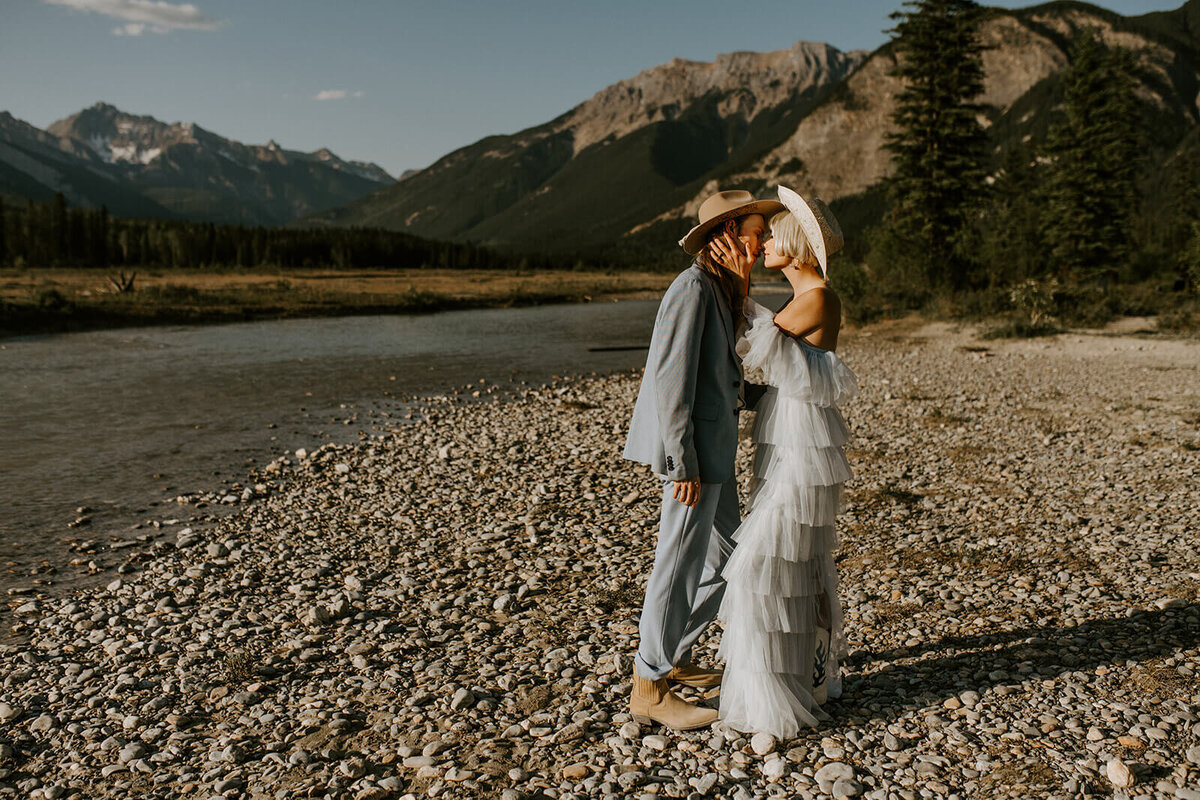 Bride-kisses-groom-in-nature-Canmore