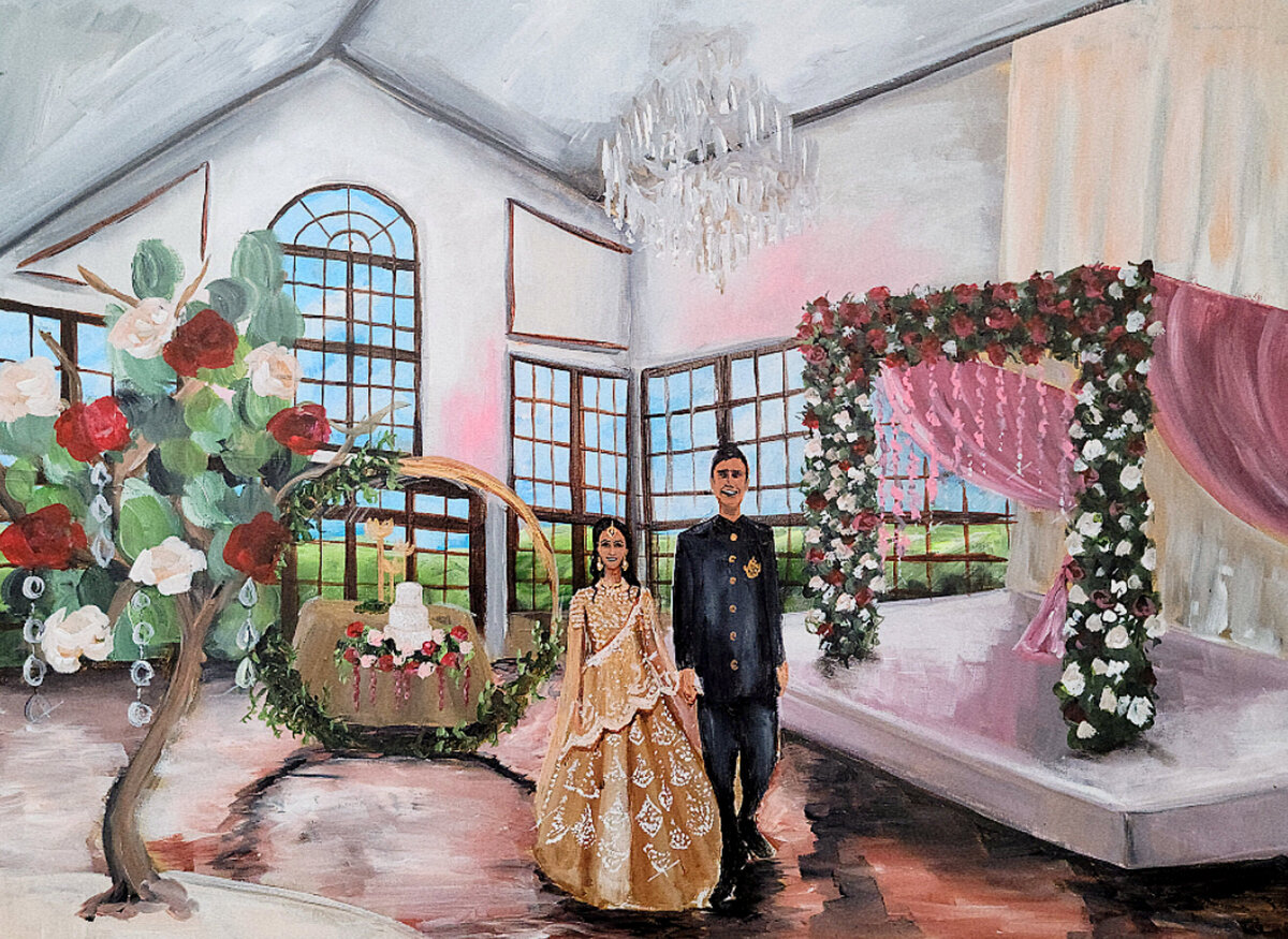 Indian wedding reception live wedding painting at Raspberry Plain Manor in Leesburg, Virginia. Couple stand next to their mandap structure.