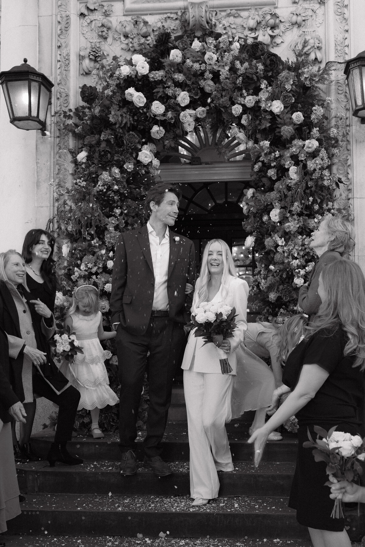Wedding photographer captures couple taking a stroll hand in hand at their french chateau wedding.