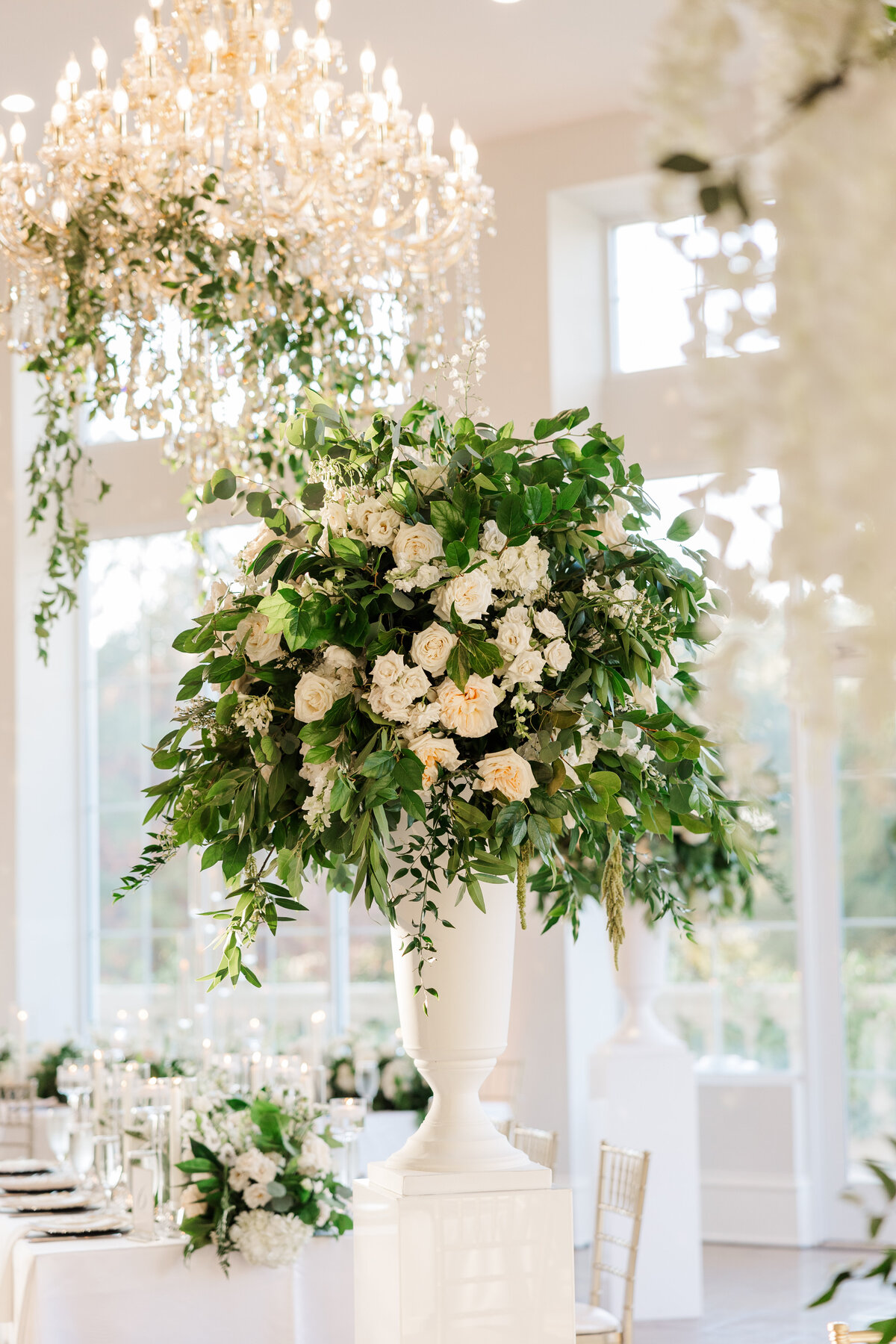 Gorgeous-ivory-florals-on-a-pedastal-at-wedding-reception-at-the-olana