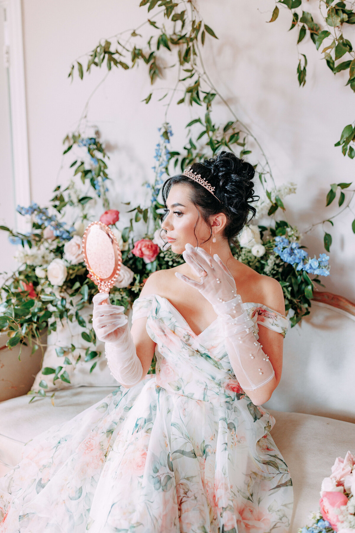 bride looking in mirror at bridgeton inspired shoot