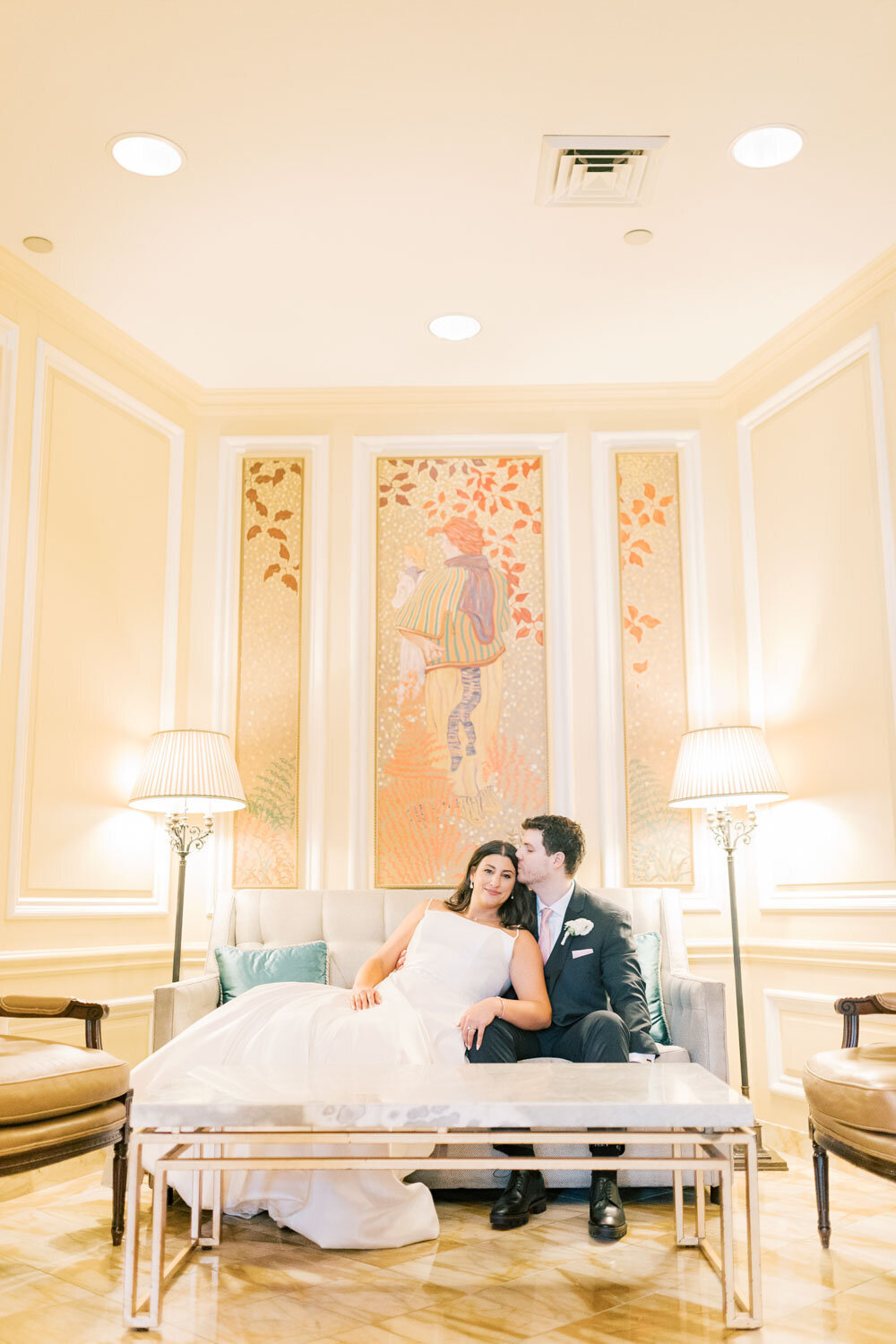 Bride and groom sitting in a luxurious venue