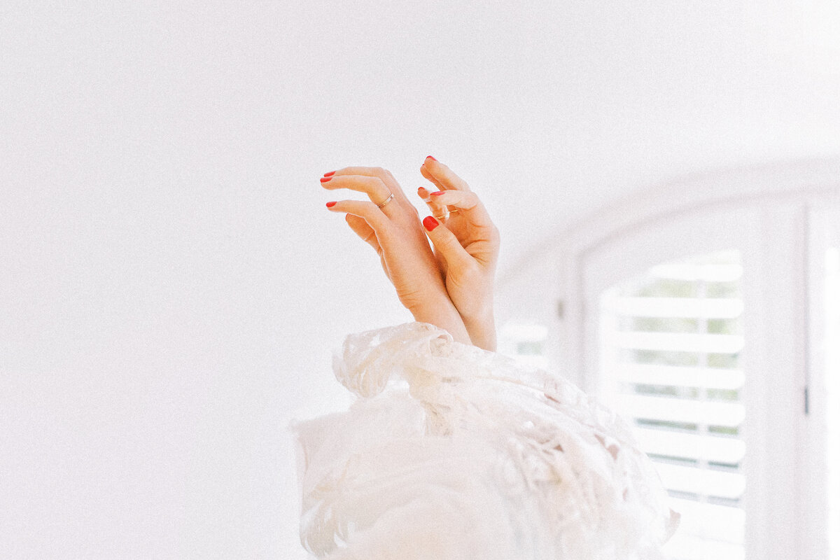award winning images by Gemma Vaughan Photography of a bride putting her dress on