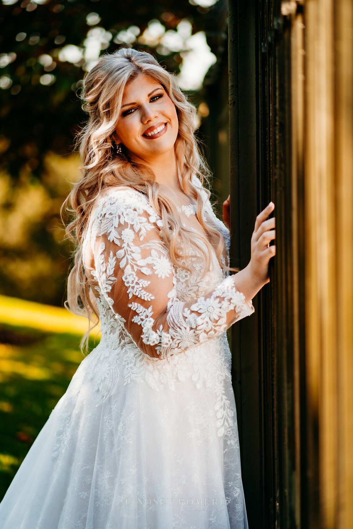 beautiful bride in long sleeve lace wedding dress at old state capital in baton rouge, la