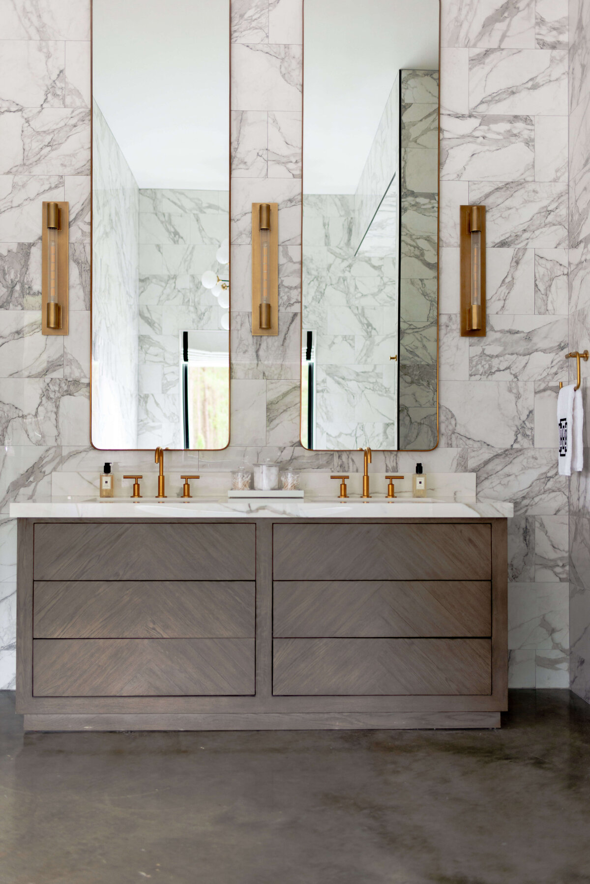 oyster creek studios building belt new build marble walls with long mirrors in bathroom
