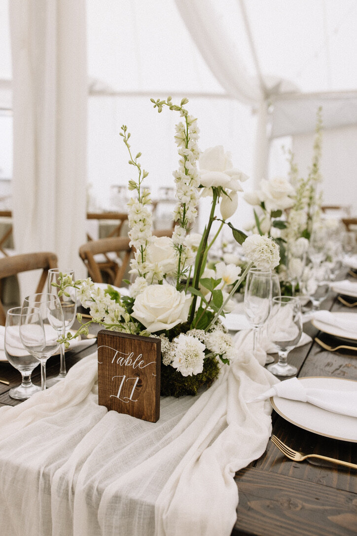 cheese cloth, moss, wood table numbers, white roses, bella donna, gold flatware, farm tables