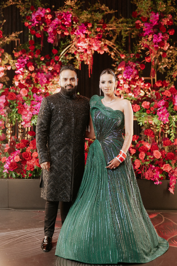 black-gold-pink-burgundy-wedding-reception-groom-bride-green-gaurav-gupta-structured-gown