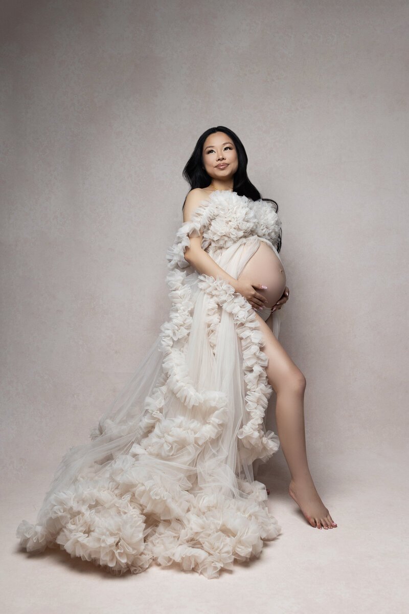 Pregnant woman wearing fluffy dress taken by photographers new jersey Ally Kimpton Photography