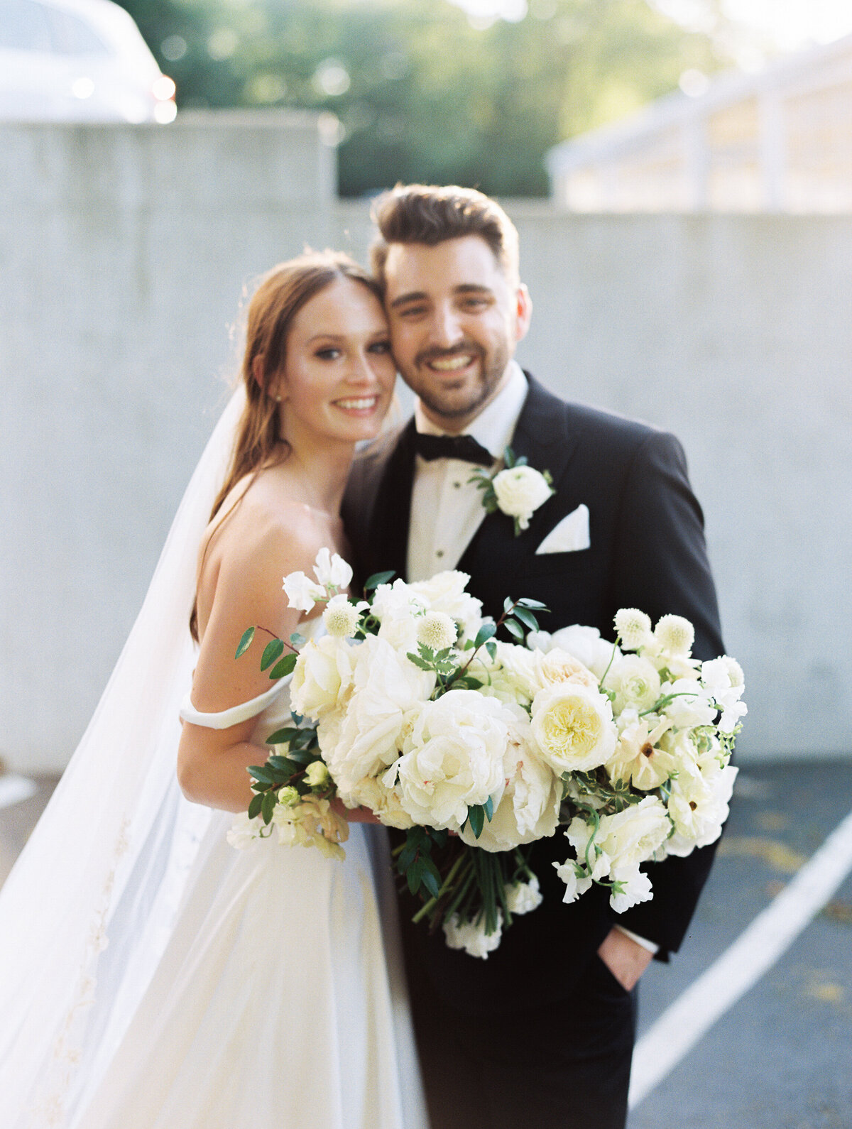 bride-and-groom-with-white-bouquet