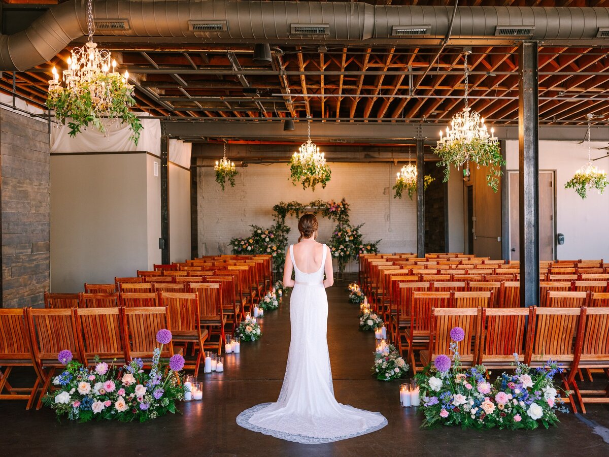 Bride viewing her ceremony for the first time with floral arrangements by project floral at Moss Denver.