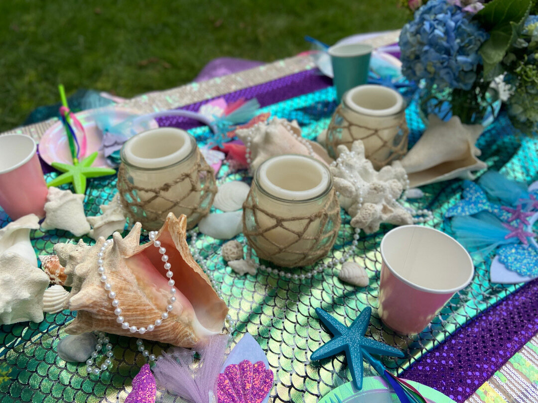 mermaid party decor with metallic table seashells and flowers