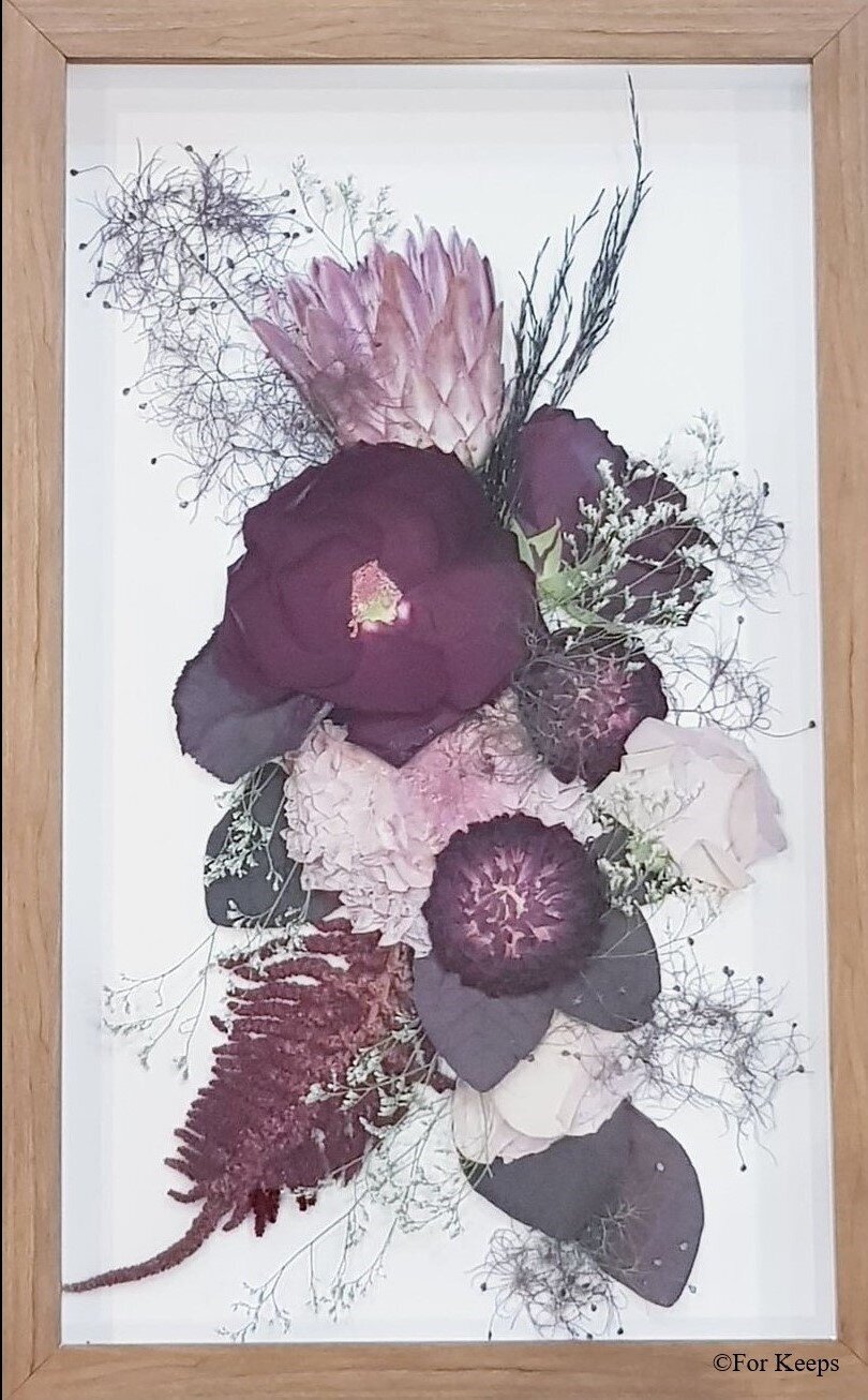 Pressed funeral flowers in custom frame.