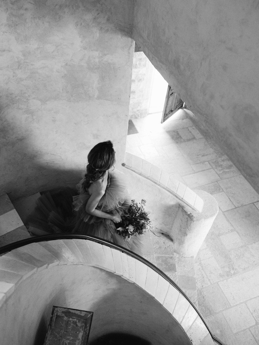bride going down the stairs in Sunstone winery wedding