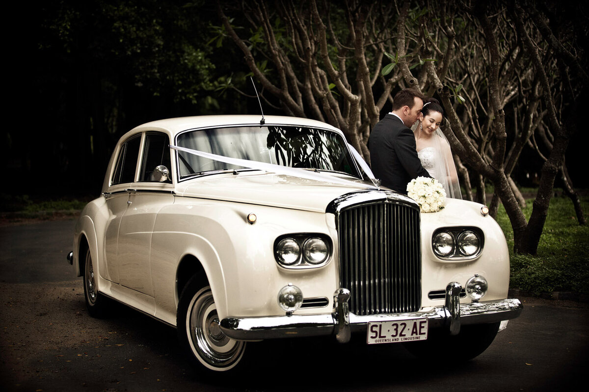 bride, groom and vintage car at Botanic Gardens, Rockhampton, QLD
