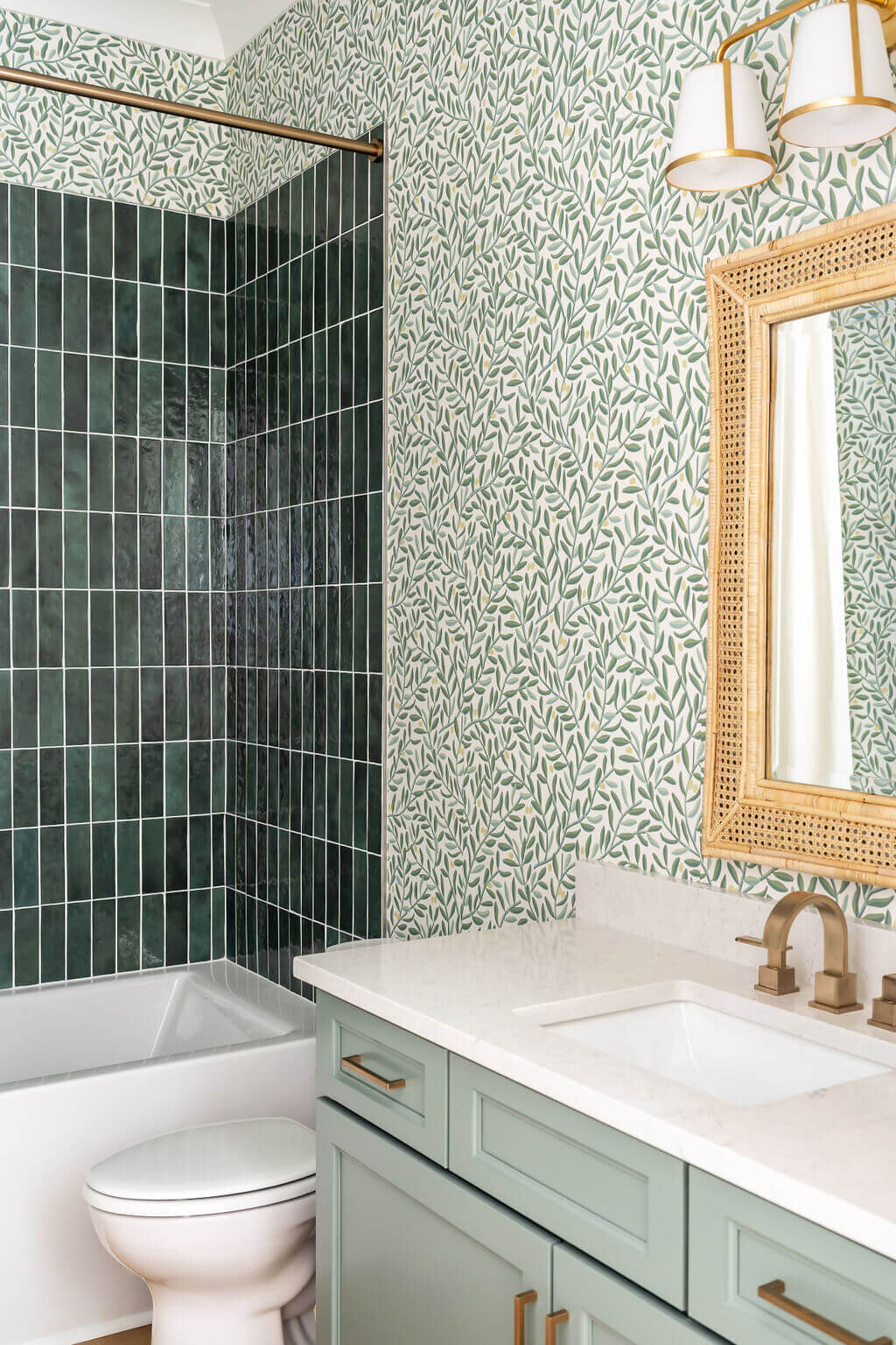 sweet southern home gracies space green floral watercolor wallpaper and light green vanity in tiled bathroom