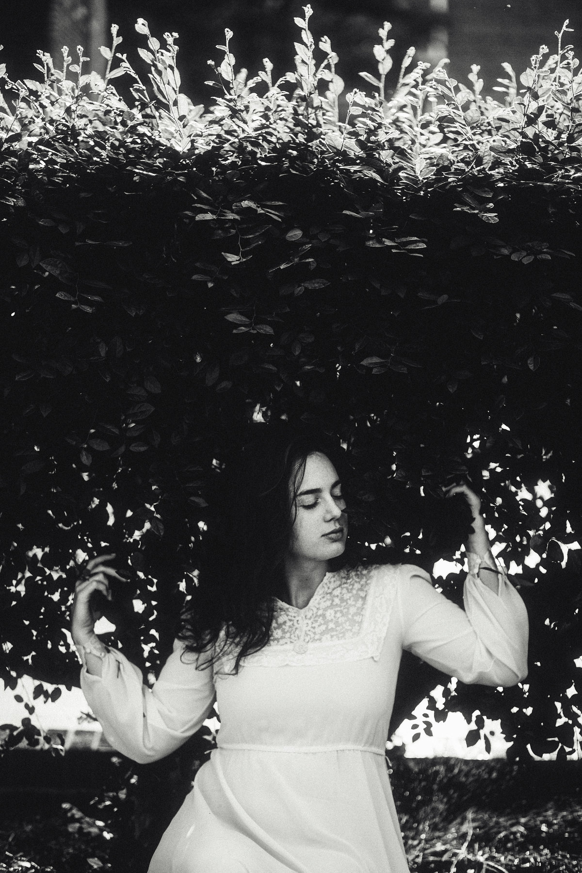 Portrait Photo Of Young Woman In Dress Surrounded By Bushes Black And White Los Angeles