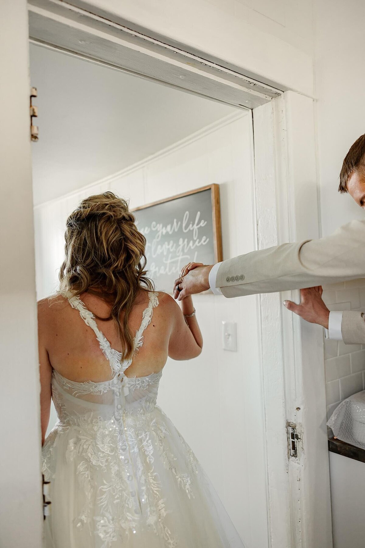 Bride holding grooms hand and walking. Wedding photography