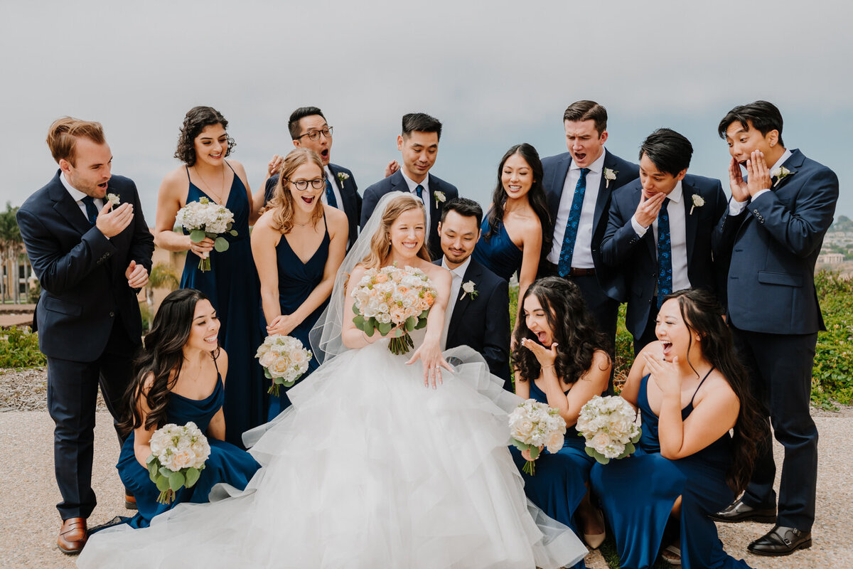 bride and groom surrounded by bridal party