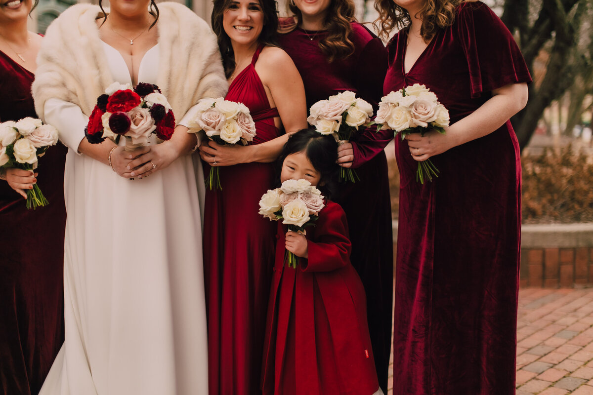 Flowergirl hides behind her flowers