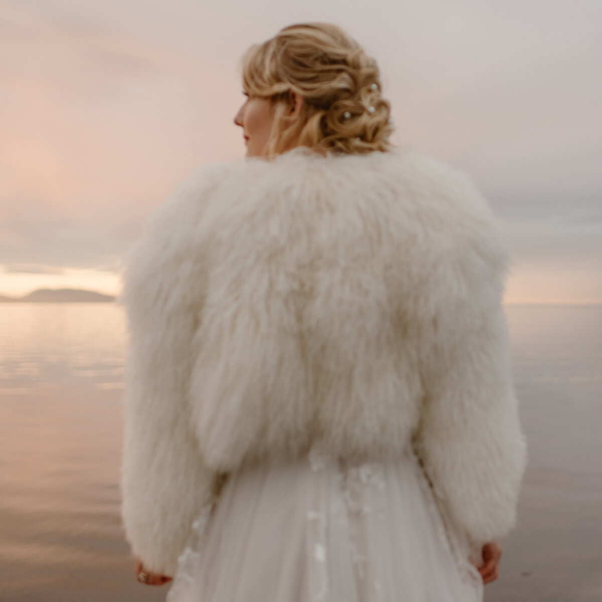 Bride in a faux fur jacket at her Washington elopement