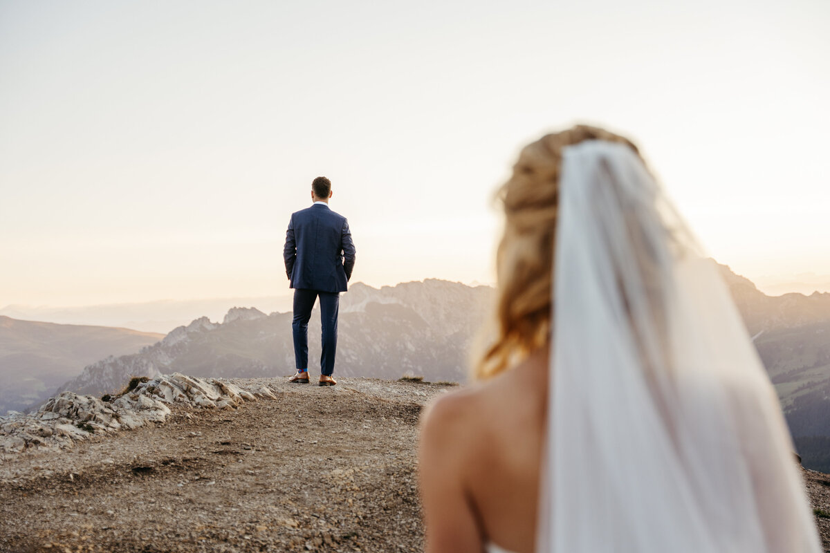 Bride and groom first look at sunrise on Seceda ridge