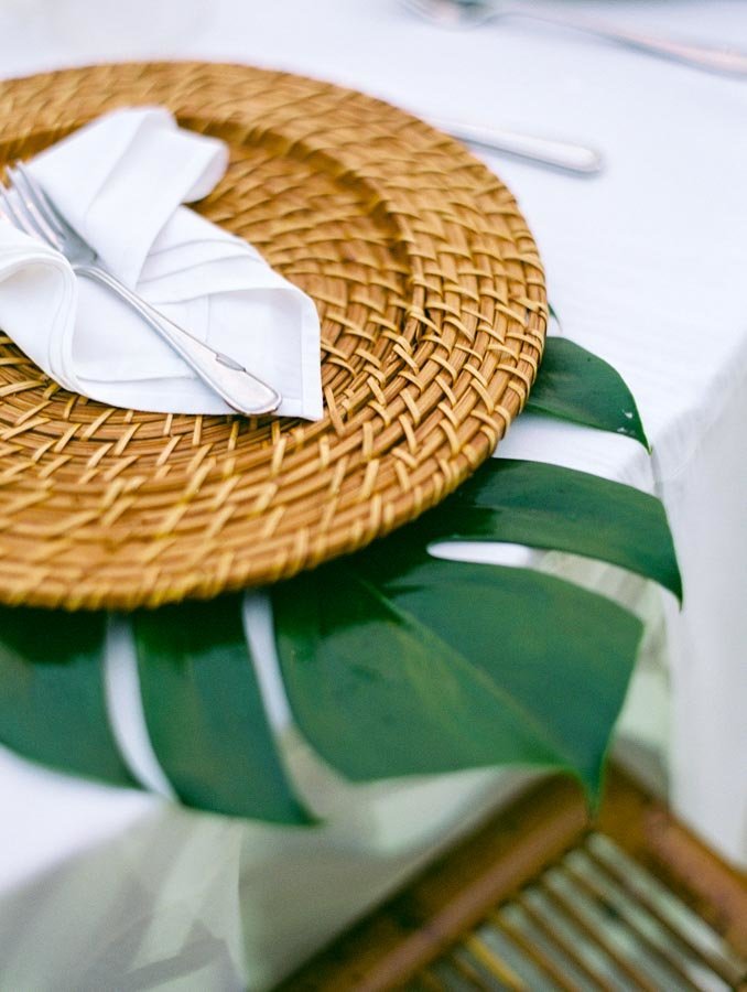 Place Setting for Tropical Wedding Monstera Leaf and Rattan Charger © Bonnie Sen Photography