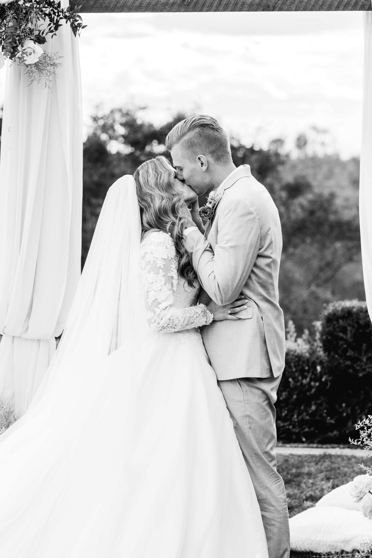 bride and groom first kiss