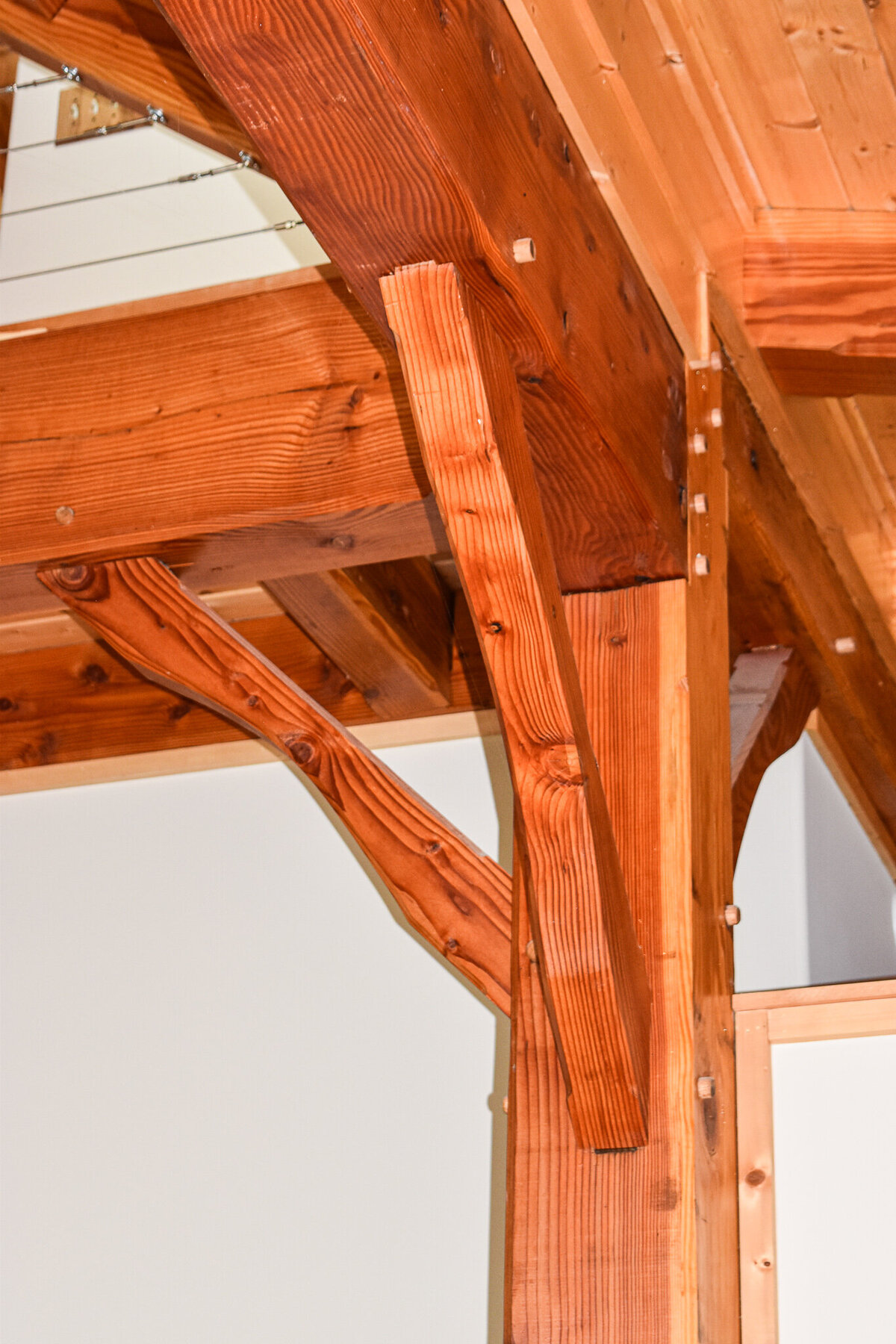 Explore stunning timberframe custom homes built by Ryan Noble Construction. Featuring exposed wooden beams, vaulted ceilings, and rustic charm, each home is a perfect blend of craftsmanship and natural beauty. Discover how timberframe construction adds warmth and elegance to your dream home