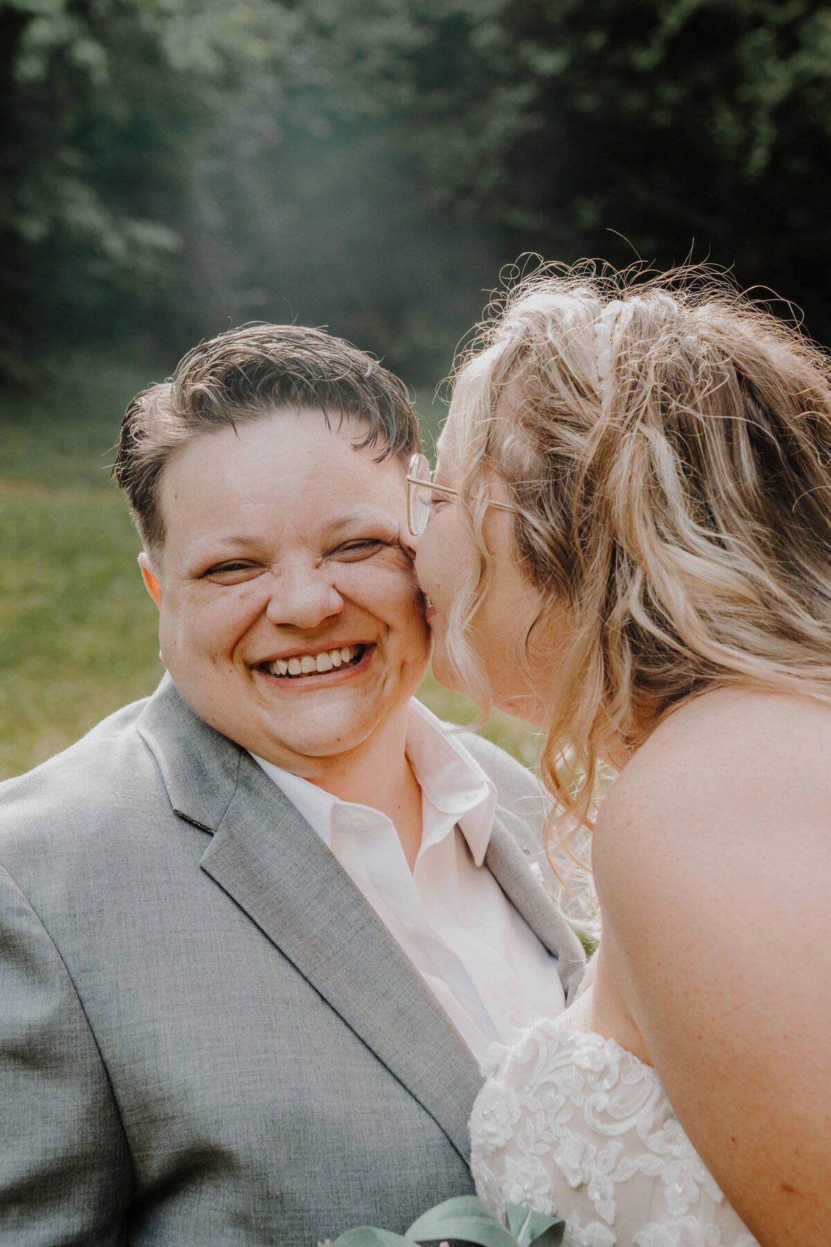 a lesbian wedding cheek kiss