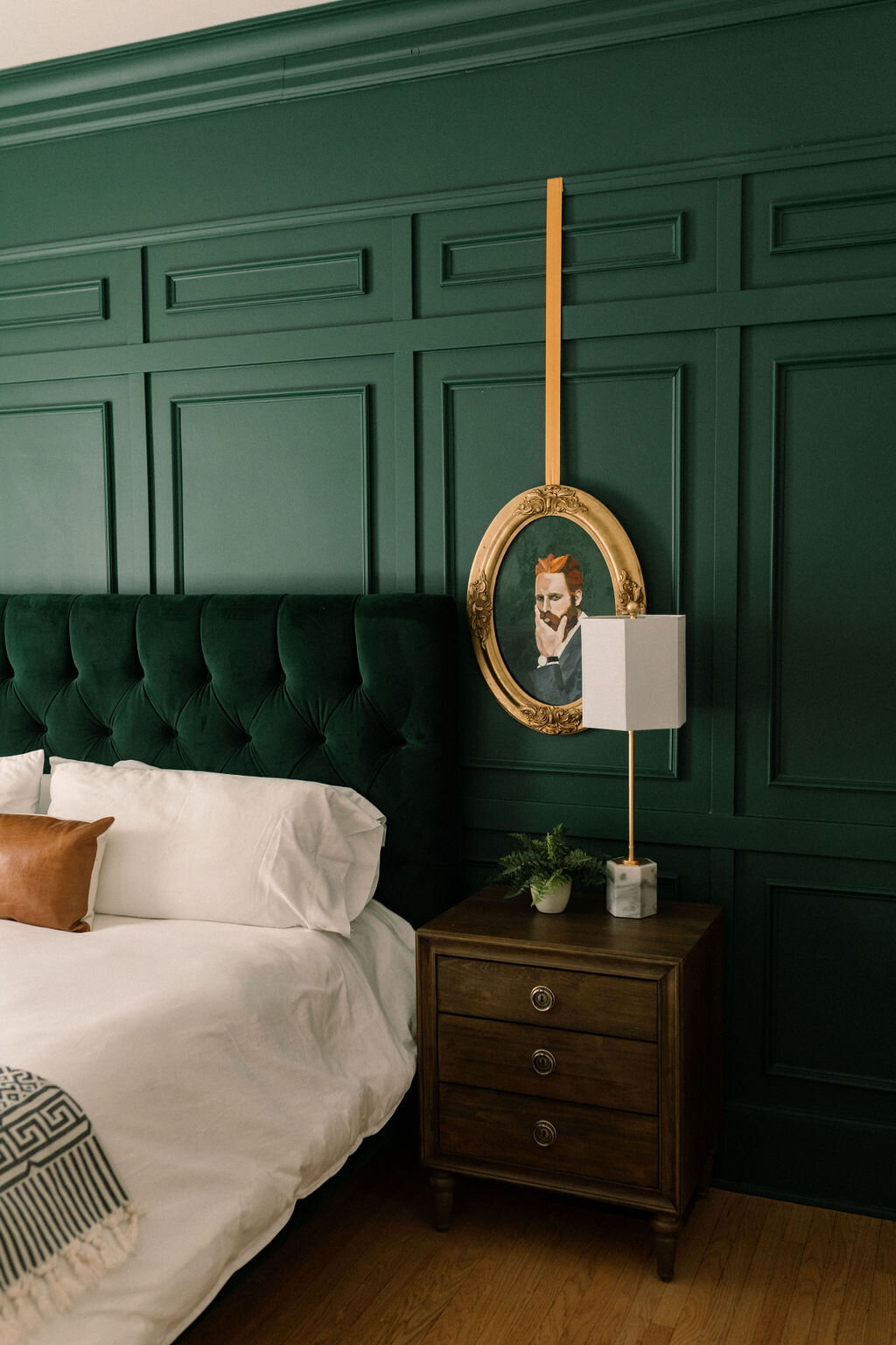 King suite bedroom with green walls at the Terry Guesthouse in Longmont Colorado