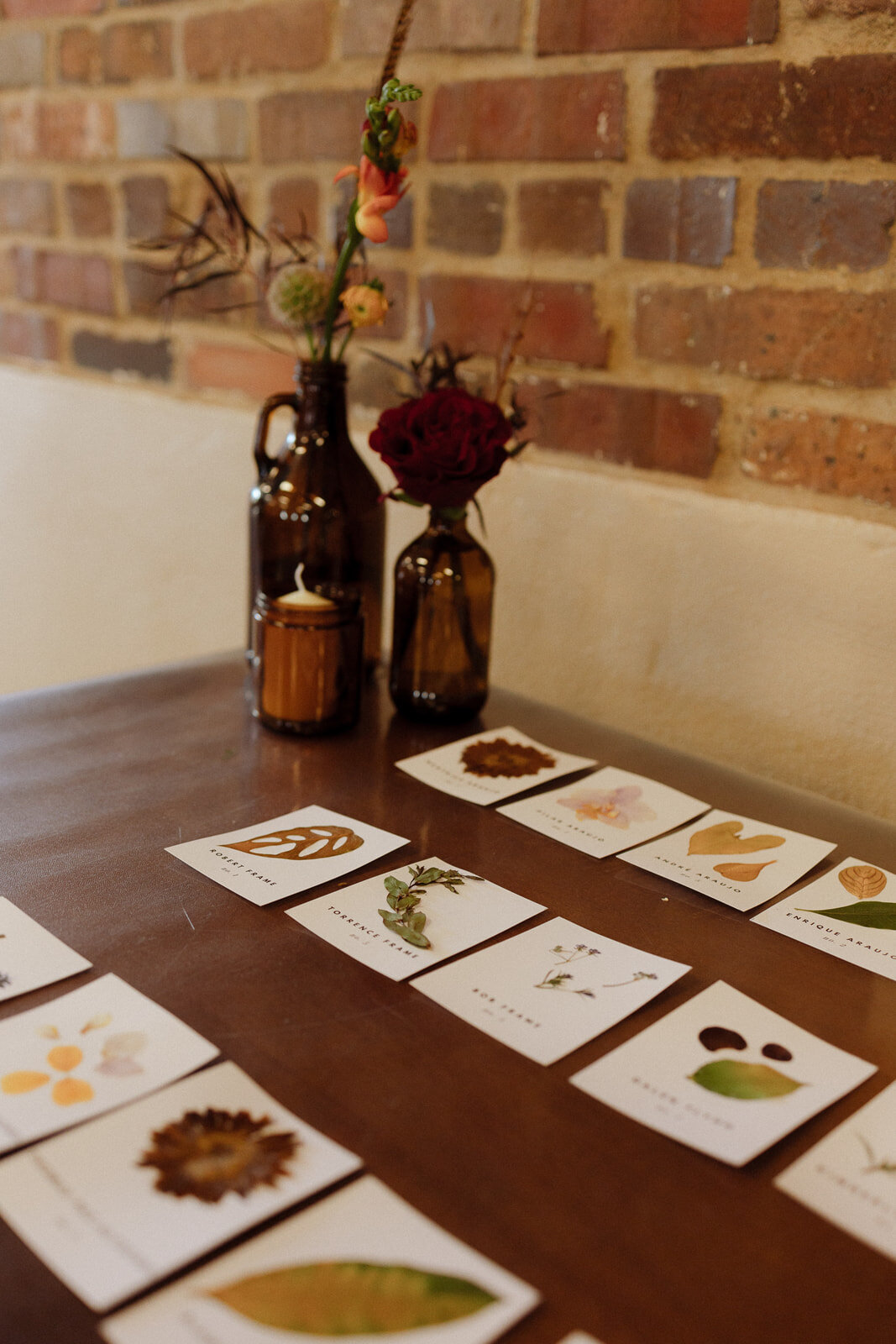 Dried leaves escort cards at a wedding reception in Denver Colorado.