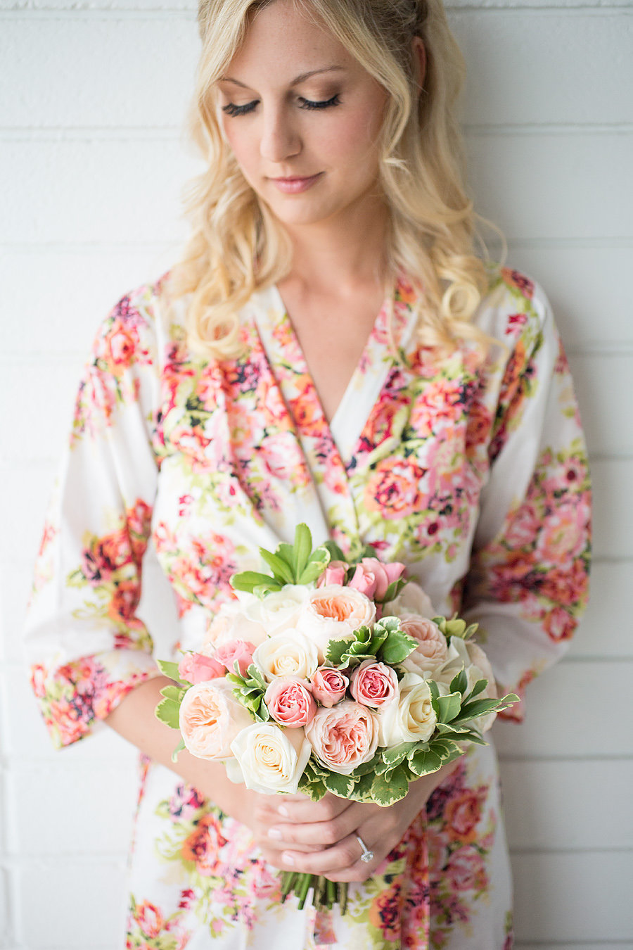 hawks cay resort bride wearing floral robe carrying a bouquet