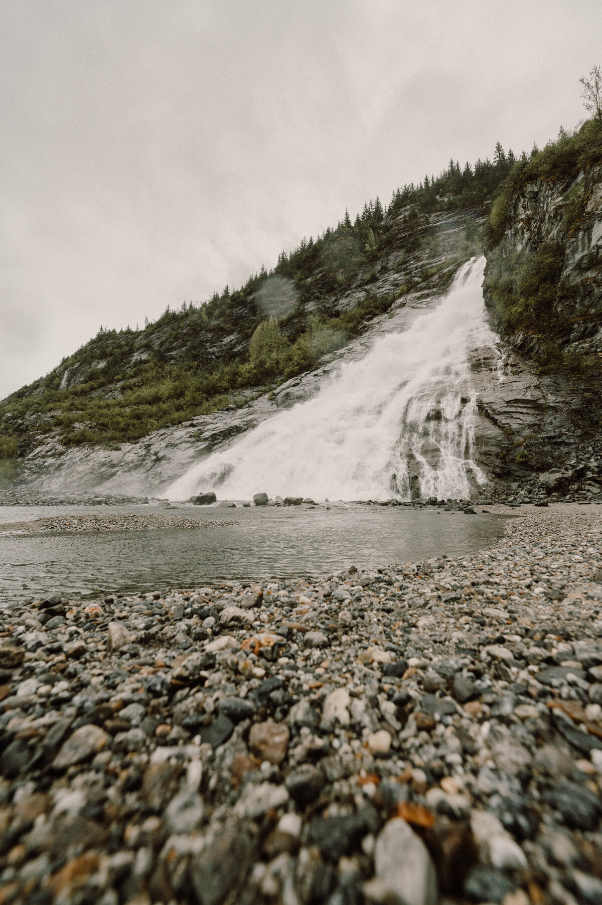 waterfall running into the lake