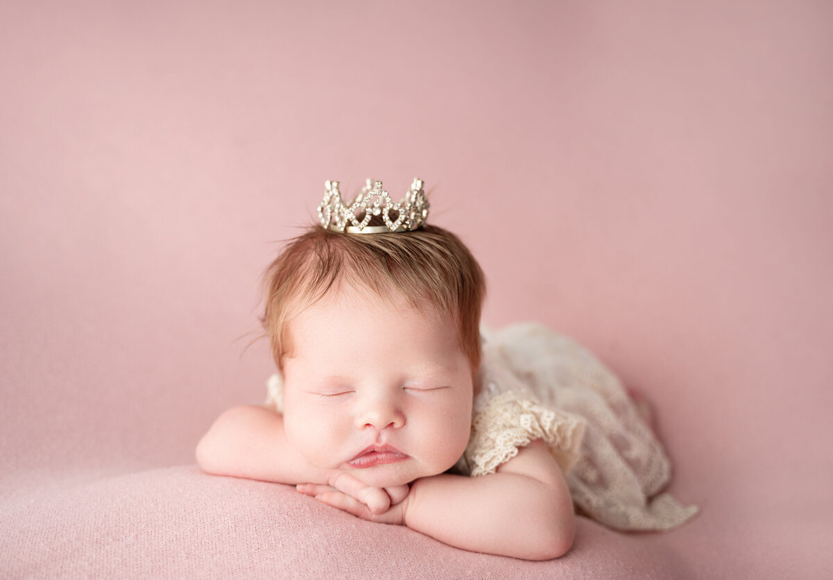 newborn baby girl with princess crown