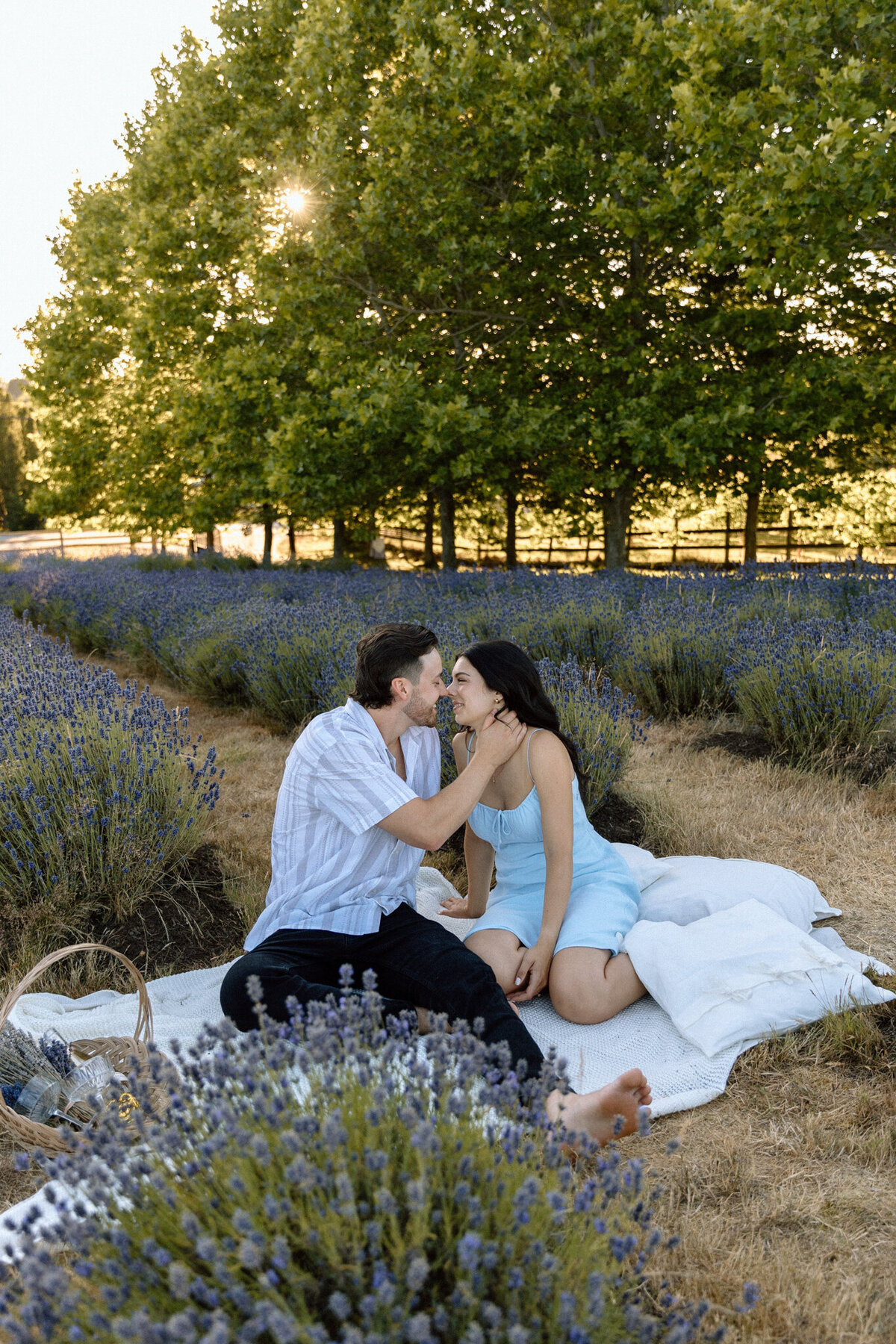 Gorgeous engagement portrait in a field of purple wildflowers, captured by Bronte Taylor Photography, a Vancouver-based photographer with a playful, genuine and intimate approach.