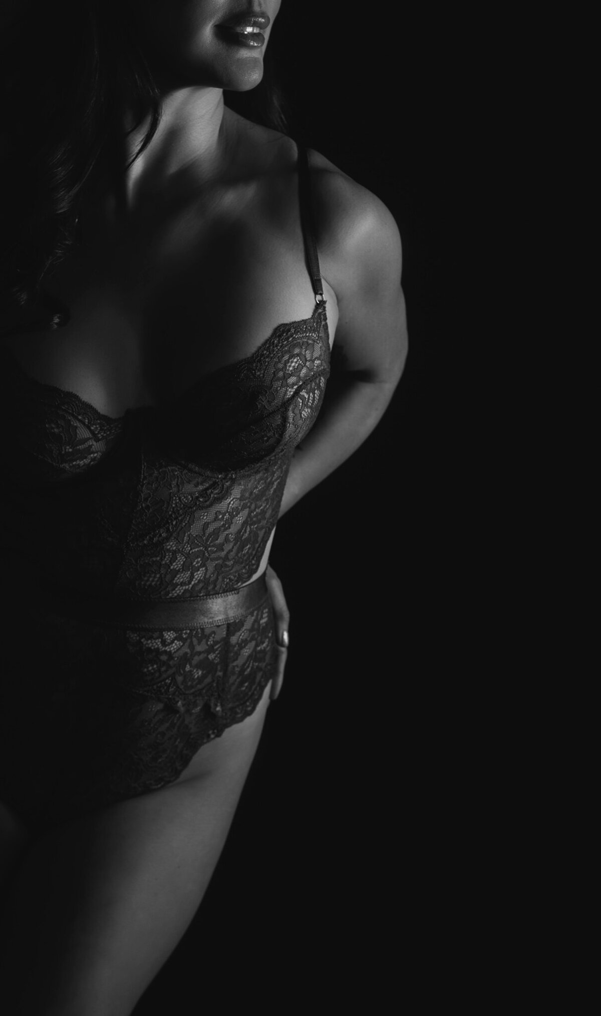 black and white elegant boudoir picture of a woman wearing lingerie in Austin