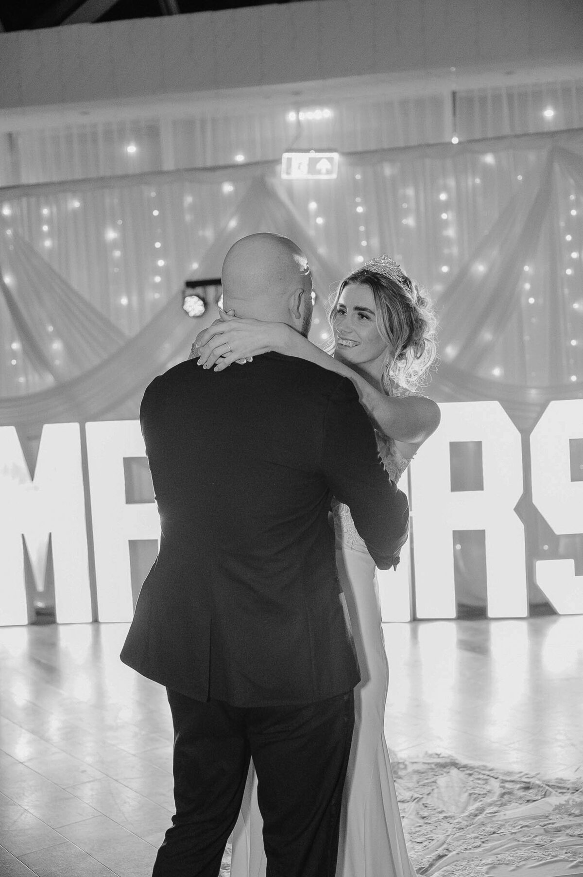 Bride hugging the groom during emotional first dance moment at  Mercury St Helens - Liverpool - Cheshire