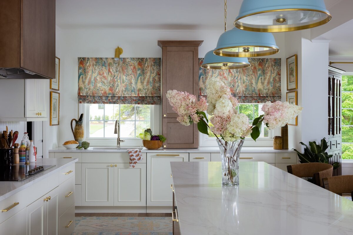 melinda chesson interiors poindexter kitchen with flowers in glass vase on the island