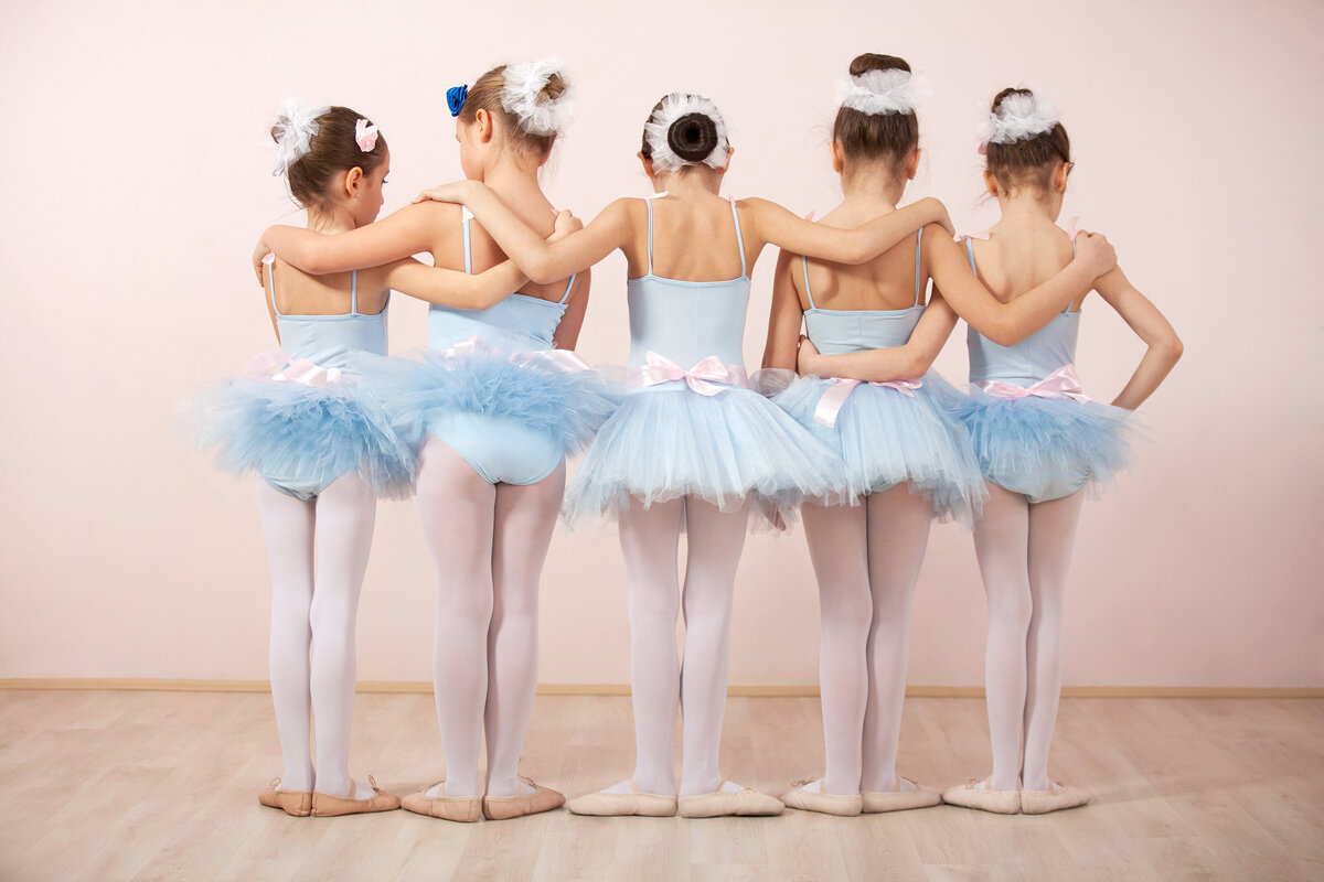 ballet dancers in blue leotard and tutu